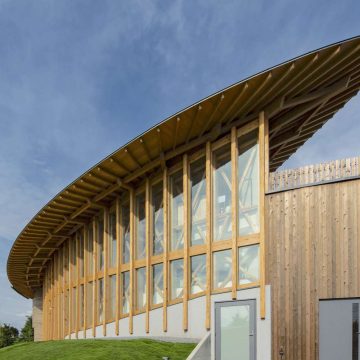 Rammed Earth & Wood Embrace the Sky in This Modern Cafe