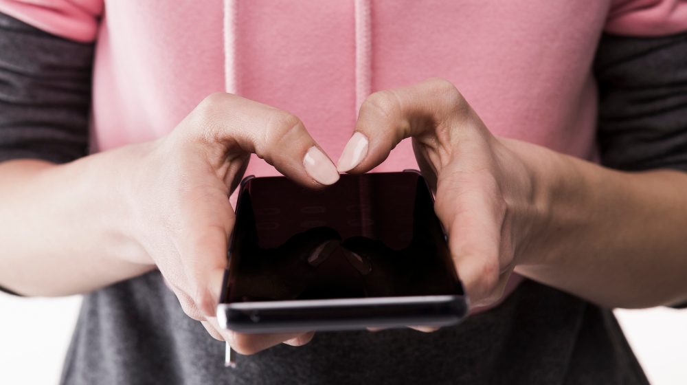 crop-woman-using-smartphone New rules ban subscription traps and fake reviews