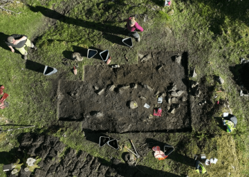Viking women’s gravesites unearthed to find jewelry, coins, and a ‘vulva stone’