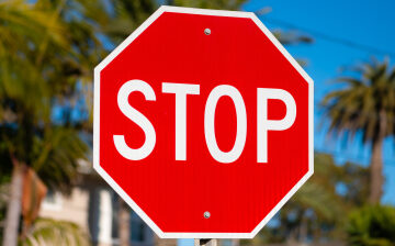 Slow Your ‘Roll’ – This Common Driving Habit Is Illegal